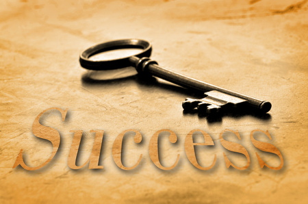 Key to Success on an old worn wooden desk topの写真素材