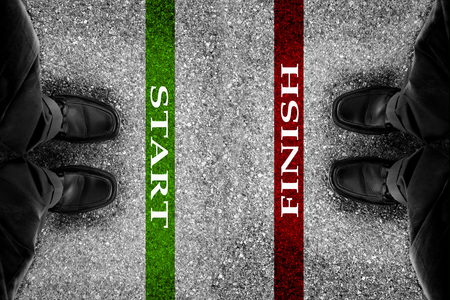 Starting adn finishing lines for race with businessman in dress shoes        の写真素材