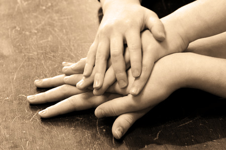 Several children hands on top of each otherの写真素材