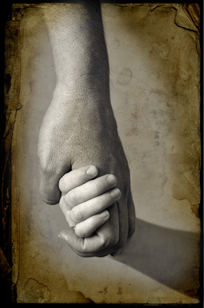Adult or parent holding the hand of a small childの写真素材