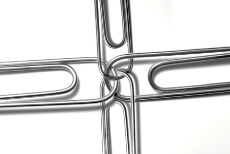 Paperclips attached to represent working together and teamworkの写真素材
