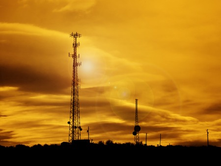 Silhouette of radio transmission tower for transmitting communication signalsの写真素材