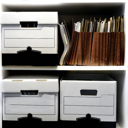 Office shelves full of files and boxesの写真素材