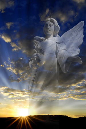 Hope and love through an Angel and rays of lightの写真素材