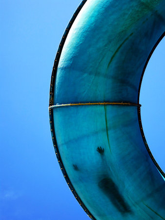 Detail of water slide at pool park with kid sliding down itの写真素材