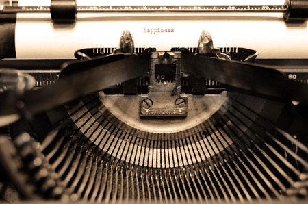 Closeup of old typewriter letters and keys for typing on documents businessの写真素材