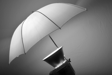 Detail of studio flash strobe light and umbrella on stand strobist professional photographerの写真素材
