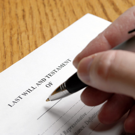 Person signing a will with an elegant penの写真素材