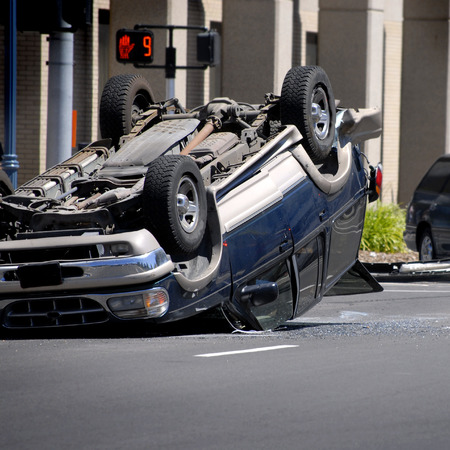 Car Wreck with a car rolled overの写真素材