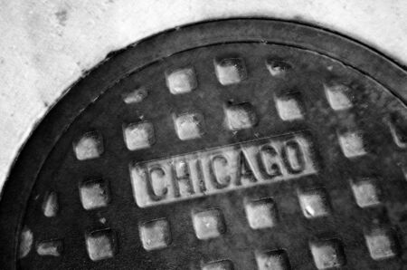 Detail of manhole cover on Chicago street textureの写真素材