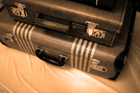 Detail of old suitcases symbolizing journey or embarking on a trip adventureの写真素材