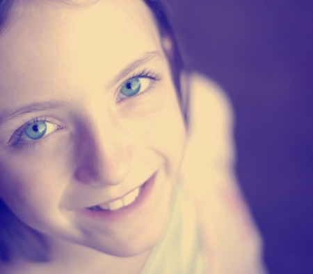 selfie of young little girl with focus on eyesの写真素材