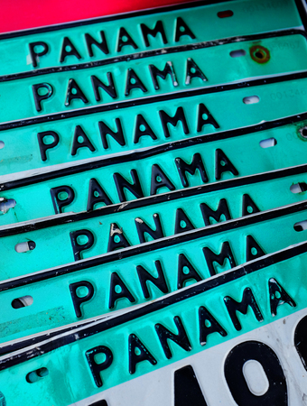 Detail of stack and row of Panama license plates for sale at marketの写真素材
