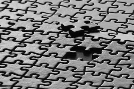 Several puzzle pieces put together symbolizing success and completion of a project