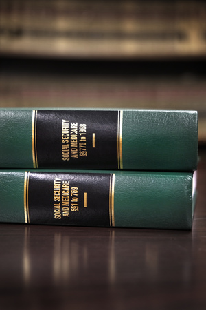 Close up of several volumes of law books of codes and statutes for Social Securityの写真素材