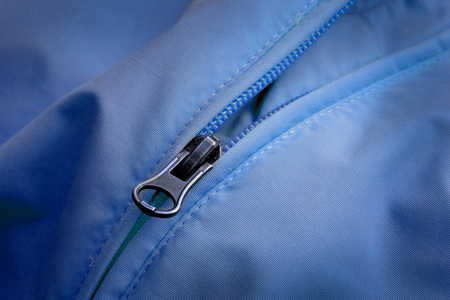Closeup of zipper on Blue coat with textureの写真素材