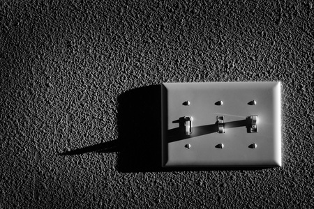 Closeup of light switch for turning on power to lampsの写真素材