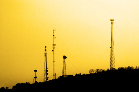 Several radio towers for transmission transmitting signals cell phone tvの写真素材