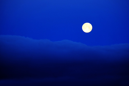 Full moon clouds blue night sky evening morningの写真素材