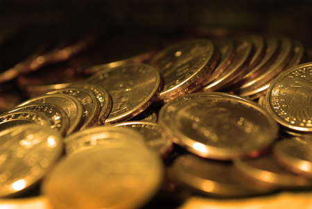 Gold coins in piles and stacks representing riches and wealthの写真素材