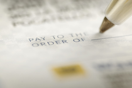 Signing a Check for Personal Financesの写真素材