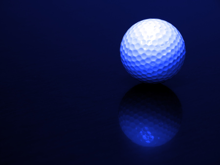 Golf ball on wood with reflection sportsの写真素材