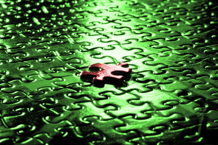 Table Surface with puzzle pieces on it showing successの写真素材