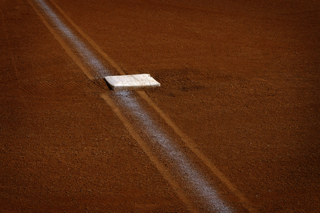 Baseball base and chalked base line in diamond