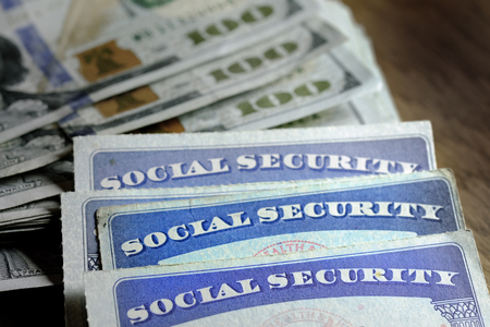Social Security cards with cash money for savings and retirementの写真素材