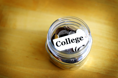Money jar for savings and investment IRA 401k retirement or college rainy day の写真素材