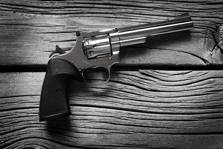 Handguns or pistols on old wood texture weapons for self defense