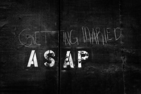 Getting married ASAP as soon as possible wall graffiti sign writing paintの写真素材