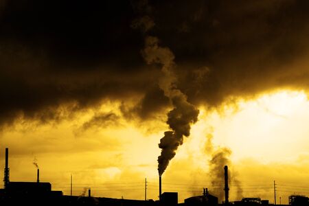 Pollution from smoke stack at a factory production bad for the environment