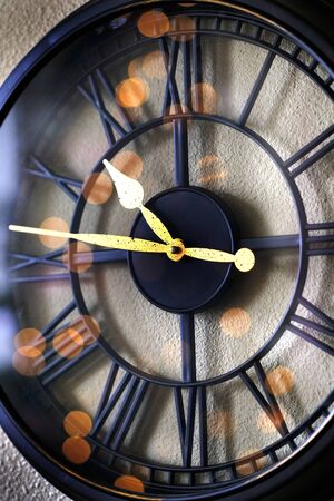 Clock on wall telling time reflection of passing of life