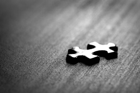 Puzzle pieces on table solving a game for fun and achievement jigsawの写真素材