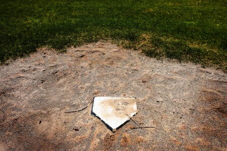 Abandoned home plate on baseball field no season to playの写真素材