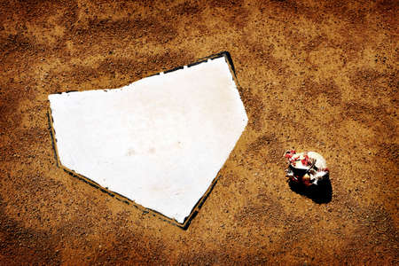 Baseball home plate ball on field sports competition dirt broken seams leatherの写真素材
