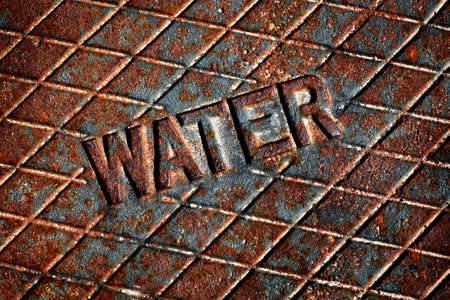 Detail of Iron Water Cover Man Hole Rusty Lidの写真素材