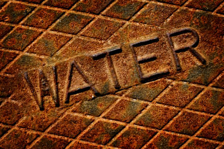 Detail of Iron Water Cover Man Hole Rusty Lidの写真素材