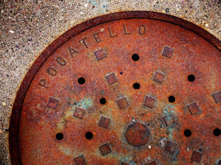 Pocatello manhole cover man hole lid rusty ironの写真素材