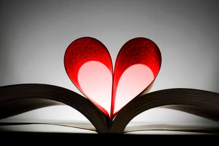 Book with heart shaped pages showing a love of reading books and learningの写真素材