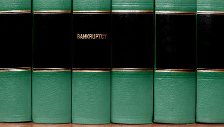 Close up of several volumes of books on bankruptcyの写真素材