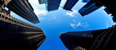Highrise skyscraper buildings in a big city with blue sky metro settingの写真素材