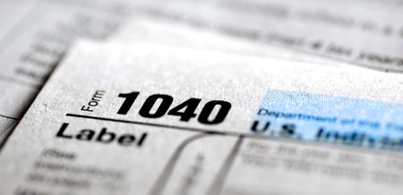 Detail closeup of current tax forms for IRS filing 1040 individual taxes on incomeの写真素材