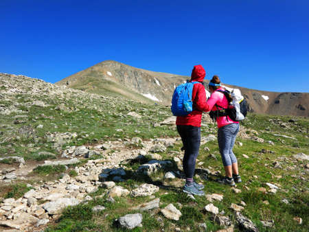Group of people climbing mountain high altitute treking climb hike hiking summit peakの写真素材