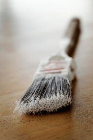 Old used paintbrush paint brush with bristlesの写真素材