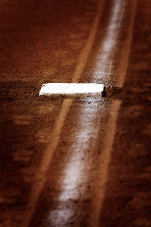 Baseball base and chalked base line in diamondの写真素材