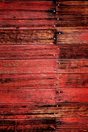 Old red barn in field late fall or autumn brown grass weathered woodの写真素材