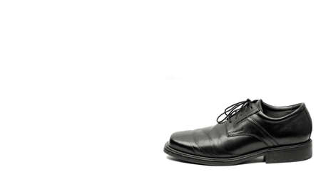 Men's black dress shoe isolated on white backgroundの写真素材