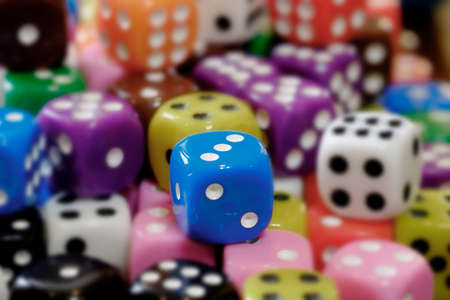 Closeup of pile of dice for gaming gambling and playing games of chance selective focus blurの写真素材